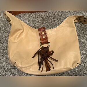 Chic Cream Hobo Bag with Brown Tassel Accents